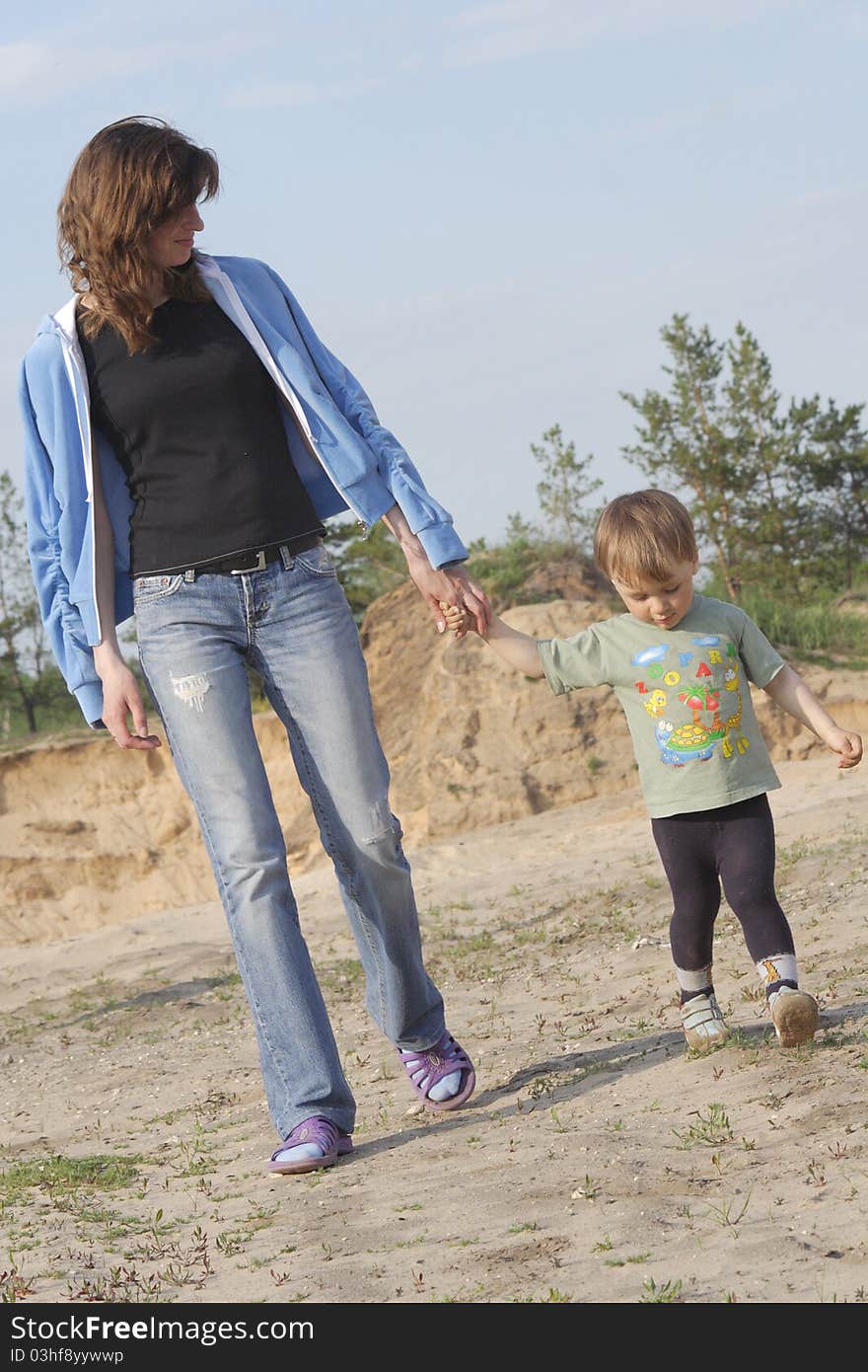 Mum and the small son on walk. Mum and the small son on walk