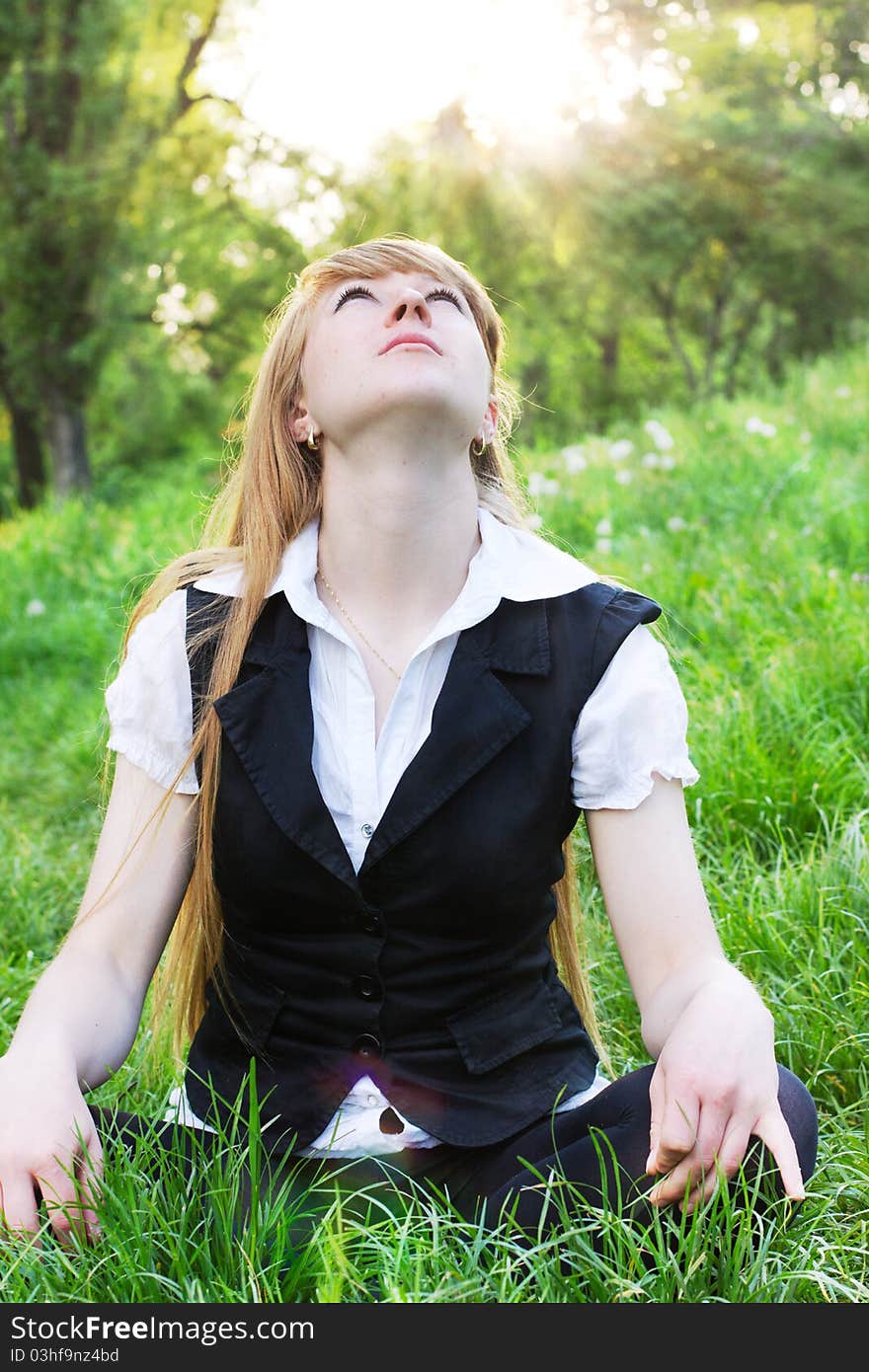 Young woman relaxing at the park. Young woman relaxing at the park