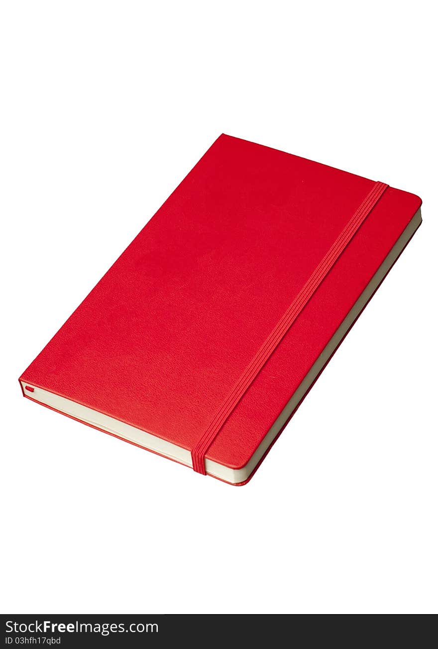 Red notepad at angle from above isolated against a white background