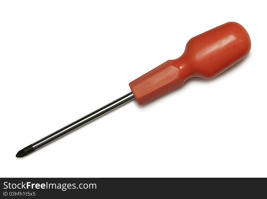 Red handled screwdriver at angle from above isolated against a white background