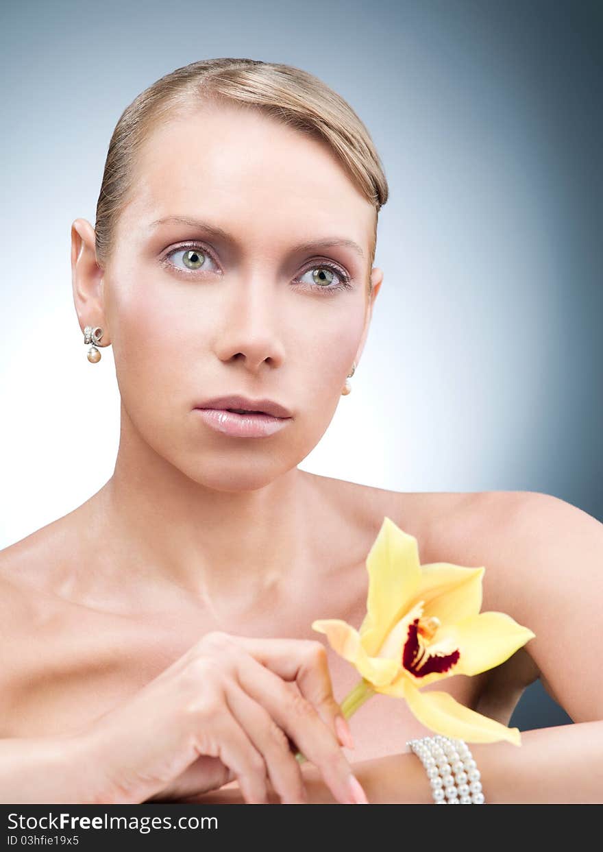 Beautiful woman with yellow flower