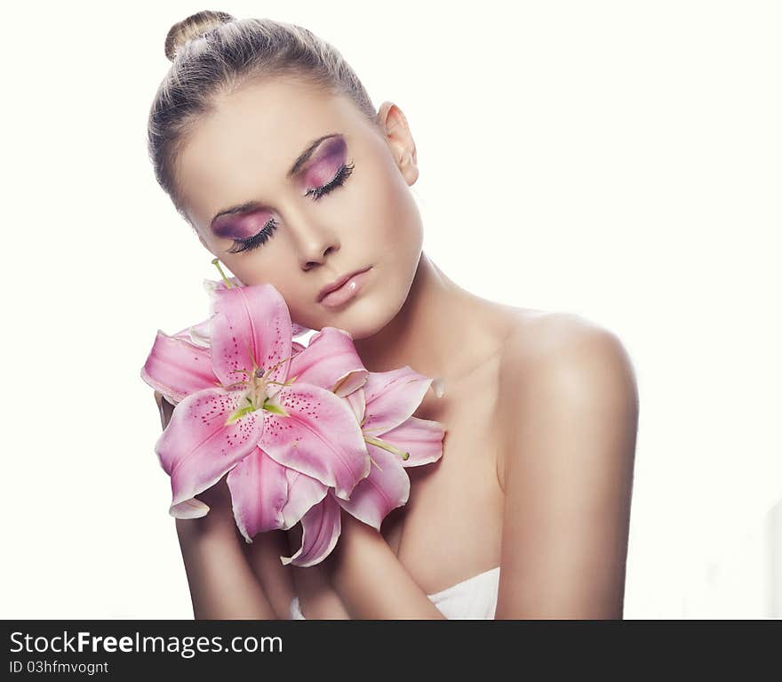 Portrait of a blond beauty with flowers on the white background. Portrait of a blond beauty with flowers on the white background