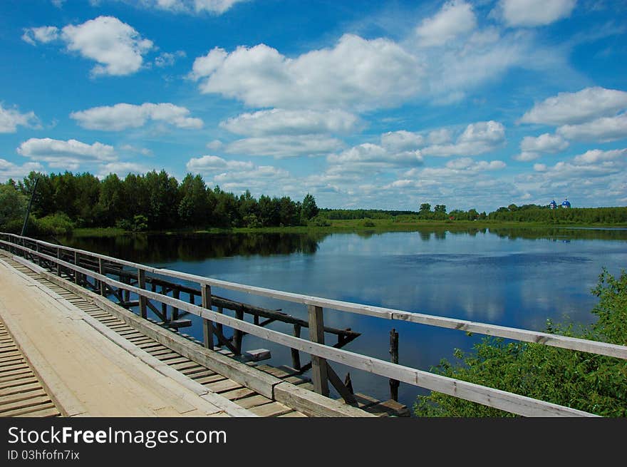 Wooden Bridge Over The River