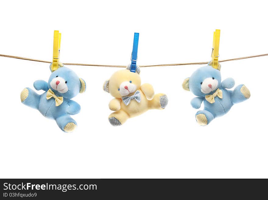 Teddy bears hanging on the clothesline.
isolated on white background. Teddy bears hanging on the clothesline.
isolated on white background