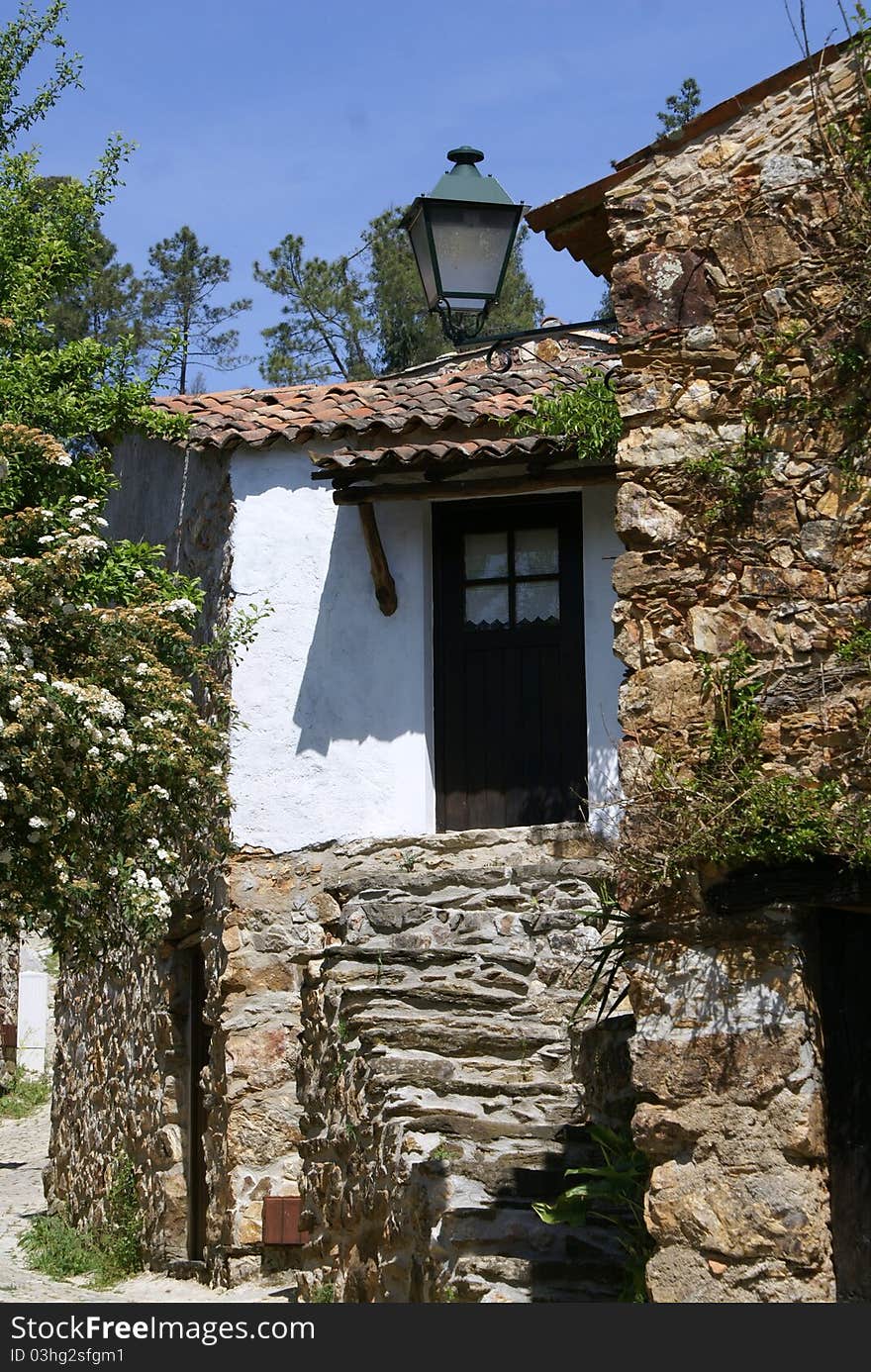 The Schist Villages consist of 24 villages spread over  in the Central Region of Portugal in an area of immense beauty and offers endless possibilities for recreation.   The houses are mixed up in the landscape dark-colored shale.  Some are abandoned, others should be recovered as, where traditions and materials were kept.  These buildings are rough but beautiful at the same time before their architectural simplicity, where the shale is invariably used in walls and slate roofs.     Generally buildings are accompanying the slope of the land and as such, have two floors.  The store, on ground floor was meant for animals and housed upstairs to the owners.   The little doors and tiny windows helped in the task because of the limited size of these openings let heat escape to guess the animals.  How man and nature were one, some thick walls can hide inside a rock, which significantly reduces the usable area.  Because they are all built very close together, the houses choked the streets, making them so narrow that not allowed for the passage of a bullock cart.  Moreover, it is estimated that some of these paths have no more than a meter wide, forcing everything to be transported on their backs.  The clay that served as the insulator and the stones with which to do the walls. The Schist Villages consist of 24 villages spread over  in the Central Region of Portugal in an area of immense beauty and offers endless possibilities for recreation.   The houses are mixed up in the landscape dark-colored shale.  Some are abandoned, others should be recovered as, where traditions and materials were kept.  These buildings are rough but beautiful at the same time before their architectural simplicity, where the shale is invariably used in walls and slate roofs.     Generally buildings are accompanying the slope of the land and as such, have two floors.  The store, on ground floor was meant for animals and housed upstairs to the owners.   The little doors and tiny windows helped in the task because of the limited size of these openings let heat escape to guess the animals.  How man and nature were one, some thick walls can hide inside a rock, which significantly reduces the usable area.  Because they are all built very close together, the houses choked the streets, making them so narrow that not allowed for the passage of a bullock cart.  Moreover, it is estimated that some of these paths have no more than a meter wide, forcing everything to be transported on their backs.  The clay that served as the insulator and the stones with which to do the walls.