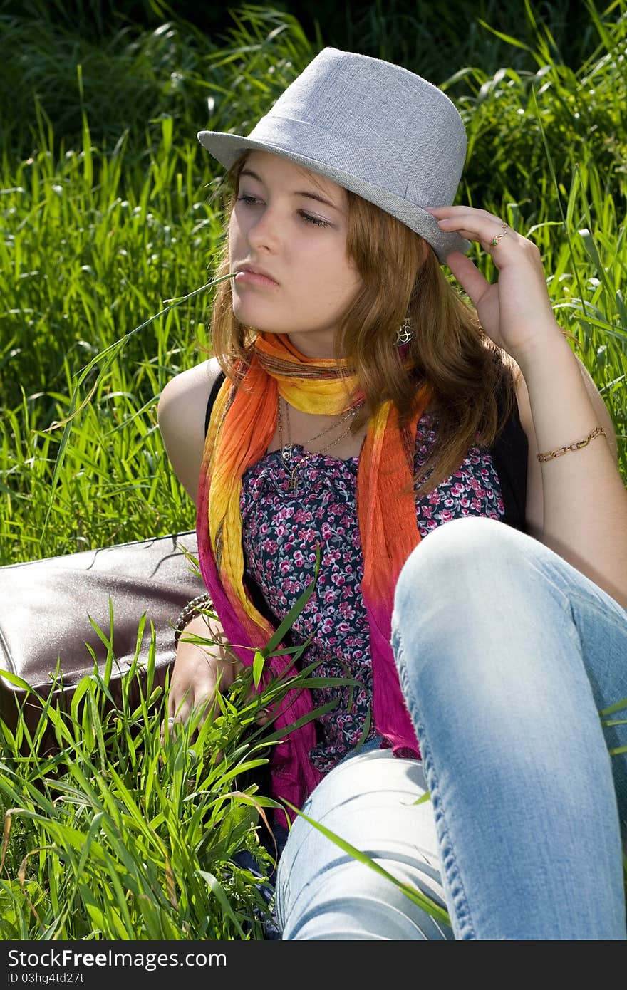 Teens girl resting on the grass. Teens girl resting on the grass