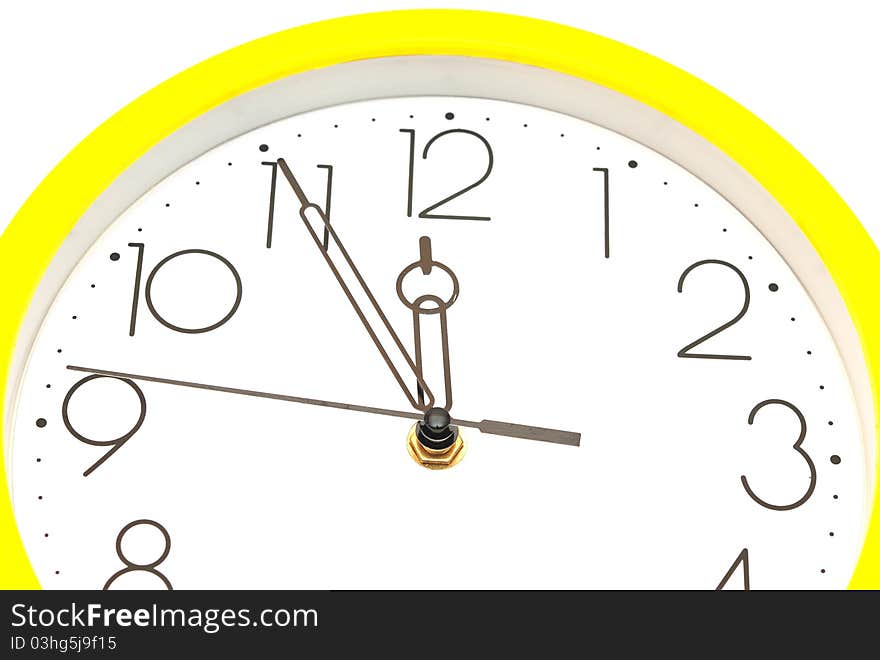 Yellow wall clock on white