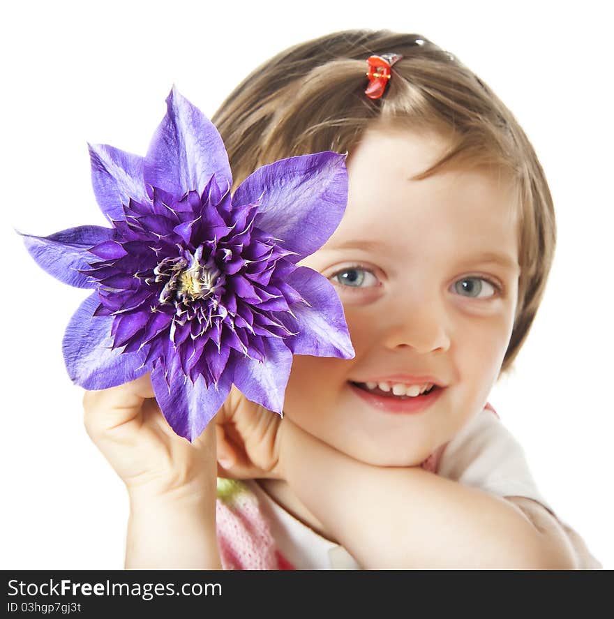 Little girl with clematis flower