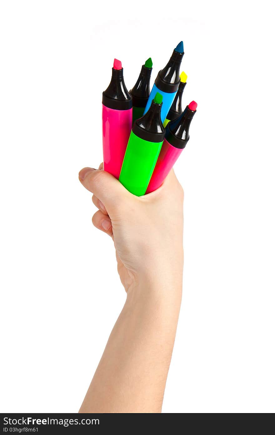 Hand holding colorful markers on white