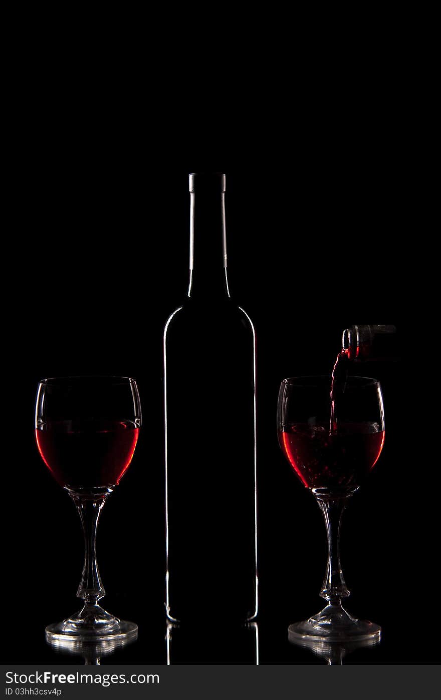 Red wine - silluette of bottle and glasses with red wine. Red wine - silluette of bottle and glasses with red wine