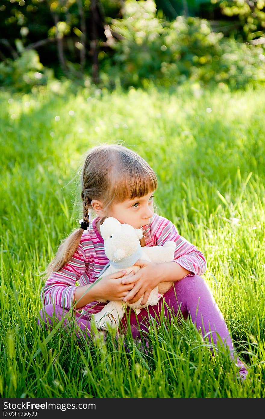 Sad little girl alone on outside the home