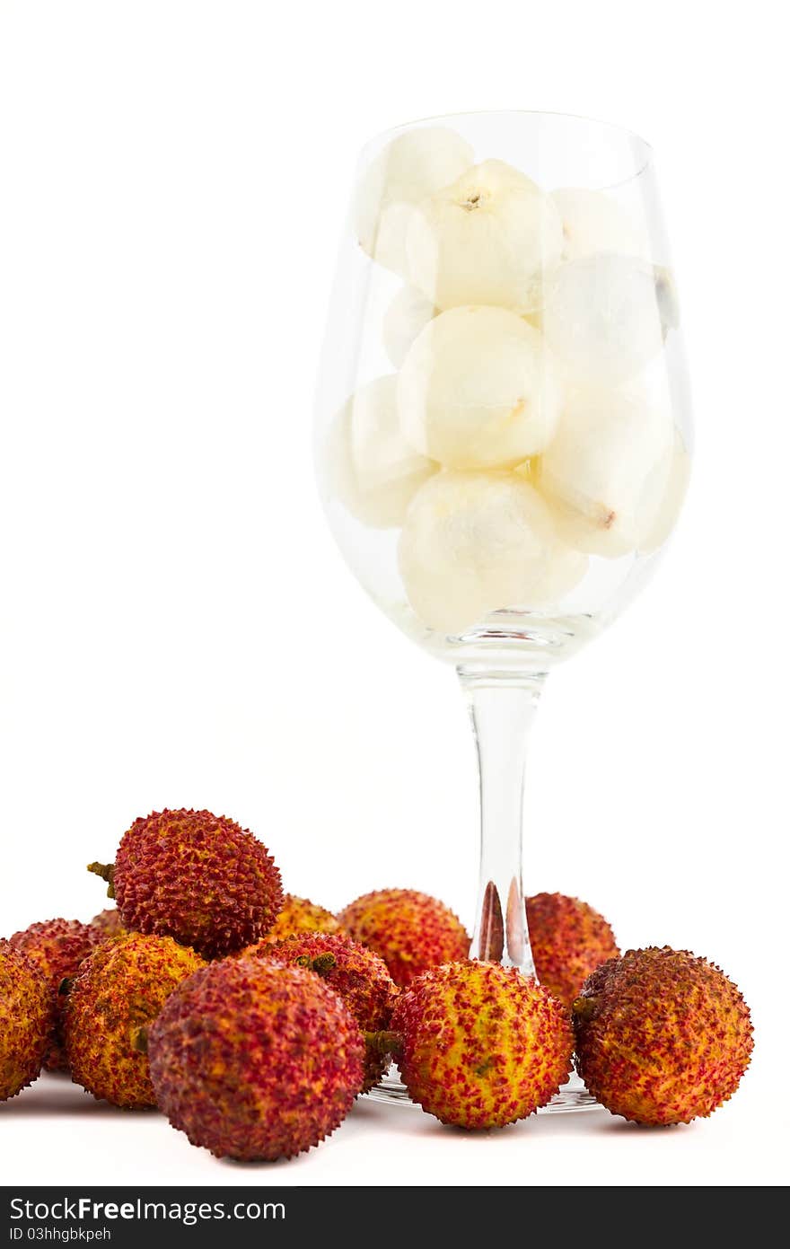 Litchi in wine glass isolated on white background