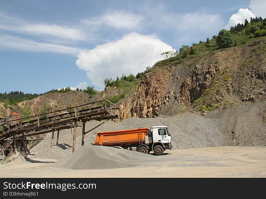 Stone quarry scenery with truck and sorting station