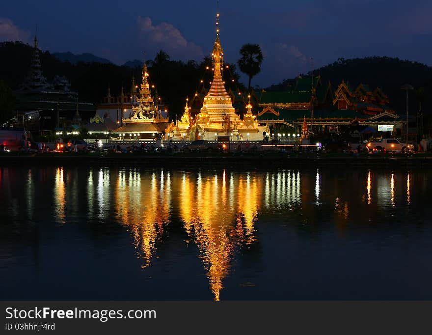 The pagoda and lighting reflect the water