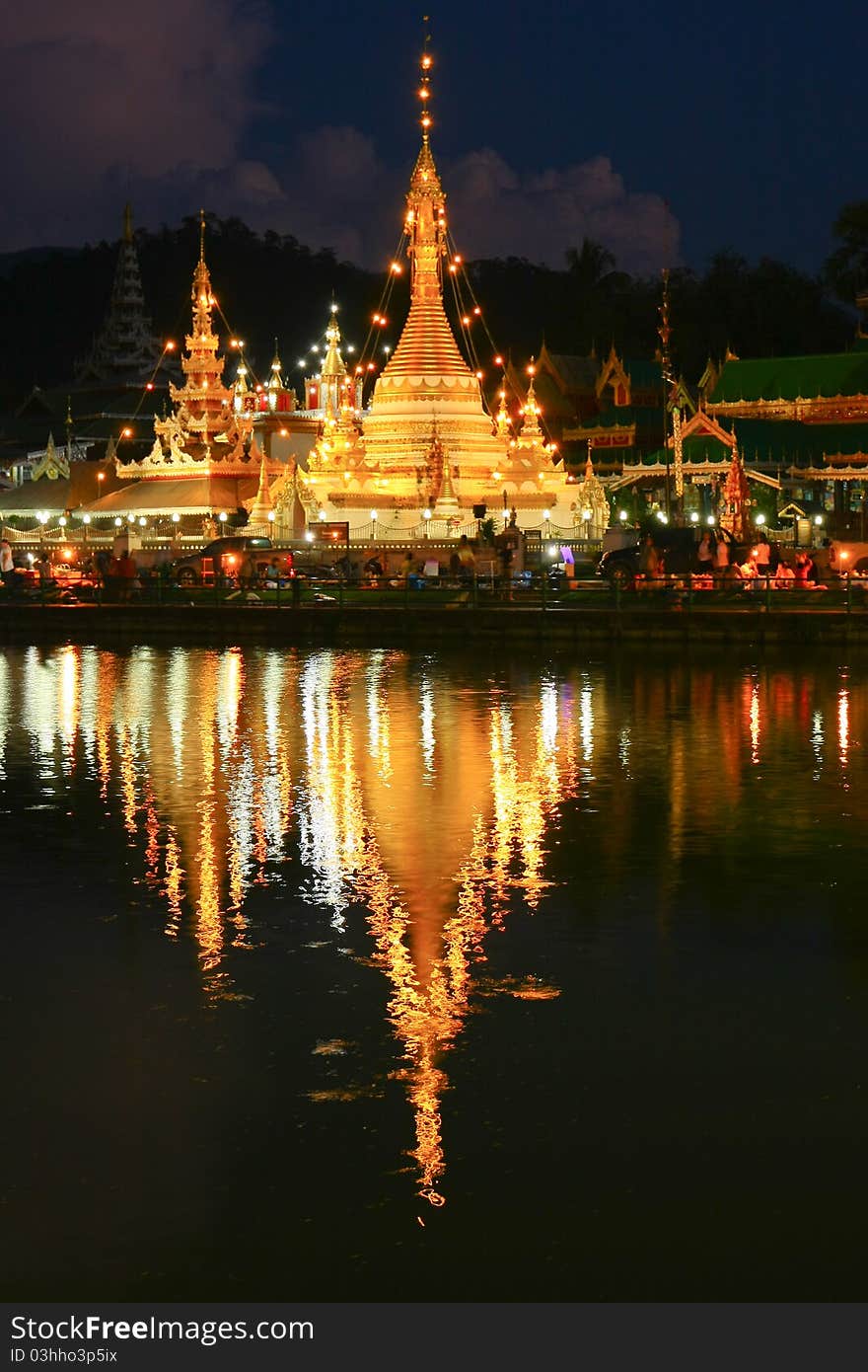 The Pagoda And Lighting Reflect The Water