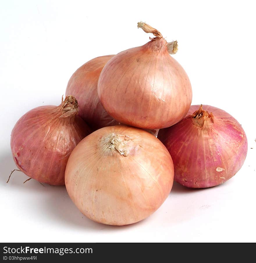 Golden onion on white background.