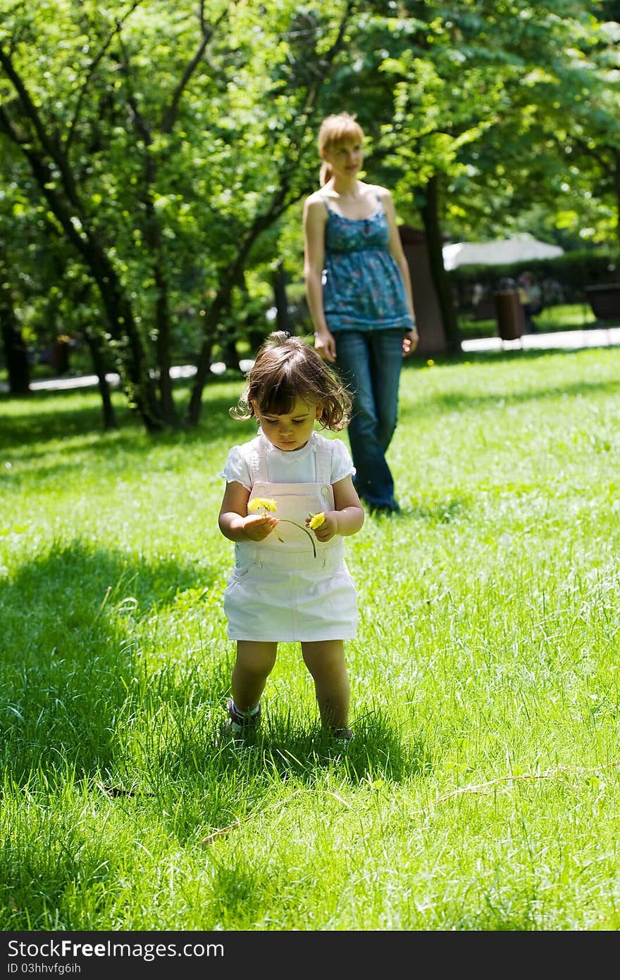 The happy child the found first spring flower in park