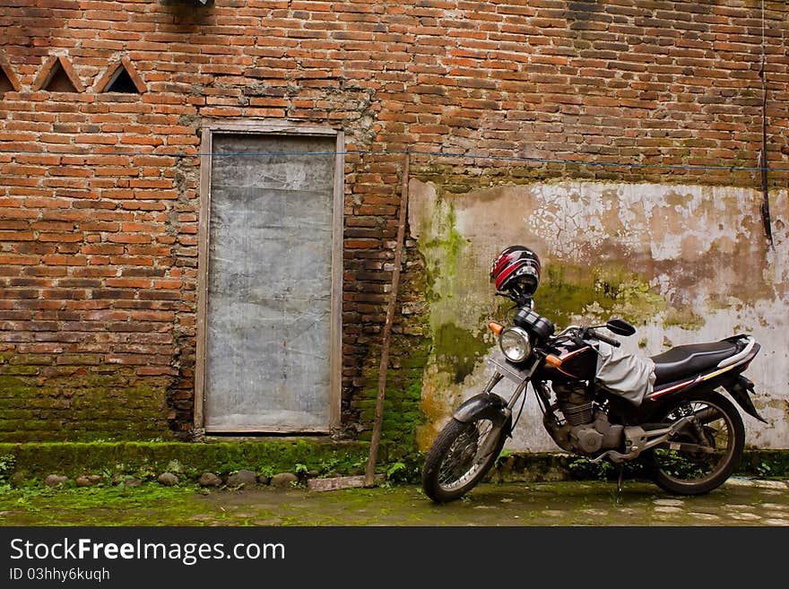 Motorcycle parking near old red brick wall. Motorcycle parking near old red brick wall