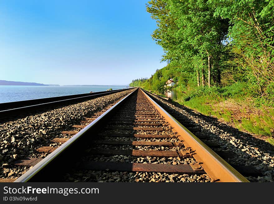 The railroad along the bay on the west coast of the USA. The railroad along the bay on the west coast of the USA.