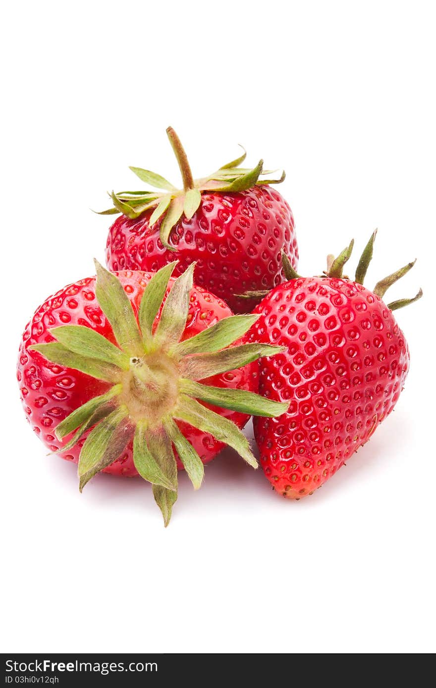 Three strawberries isolated on white