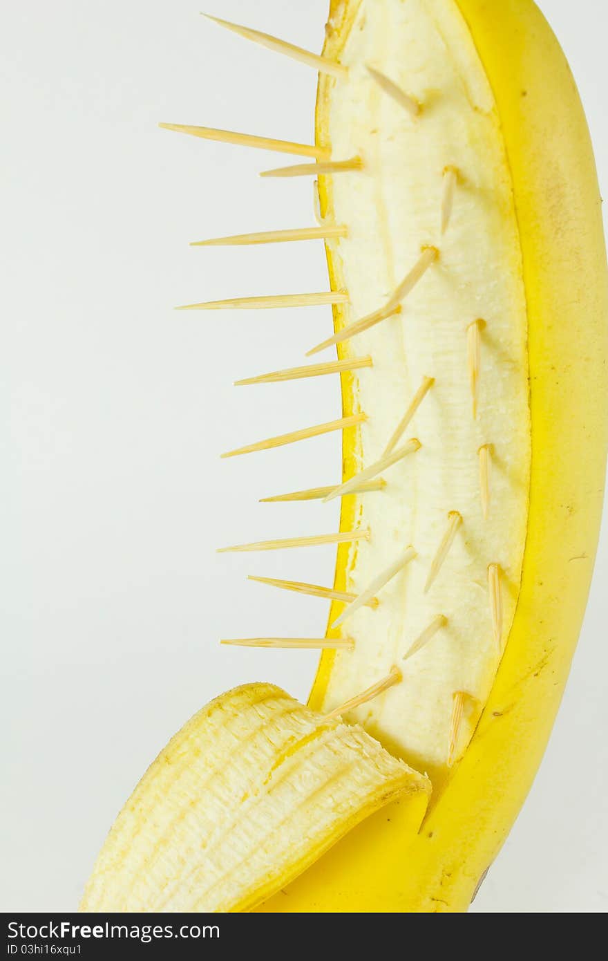 Ripe banana with spine isolated on white background