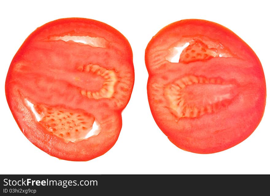 Two slices of red tomato