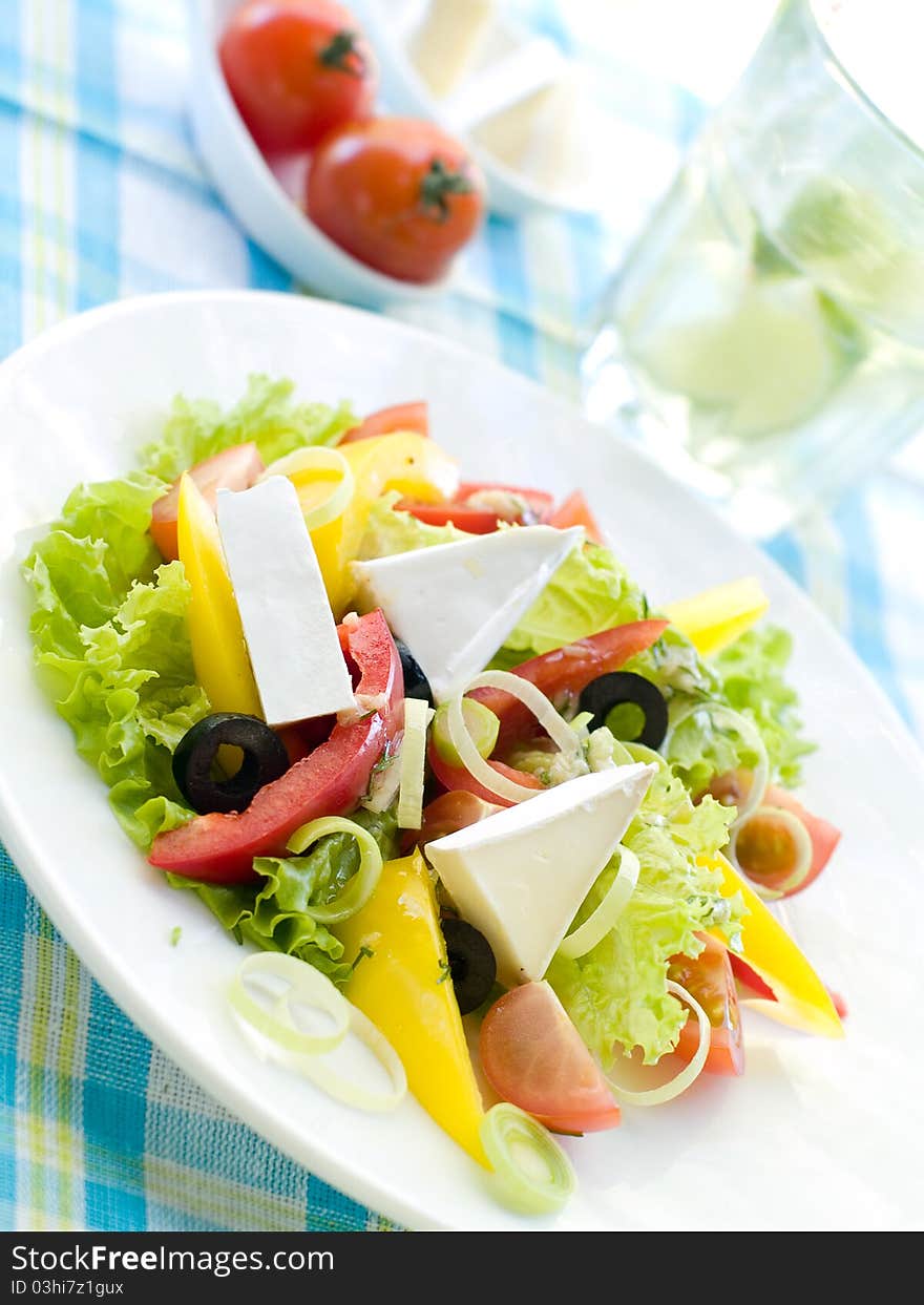 Gresh vegetable salad with cheese. Shallow depth, selective focus