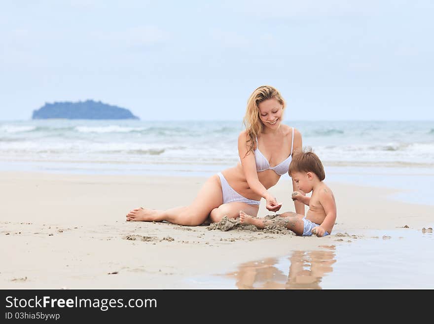 Baby with mother on a beach. Baby with mother on a beach