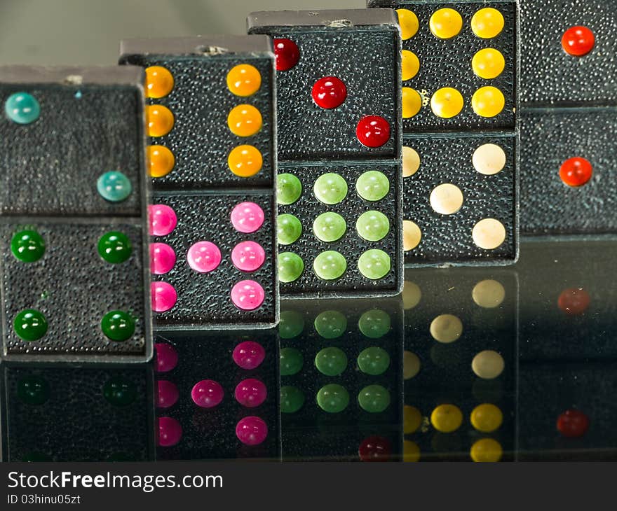 Colorful Dominoes on reflect background