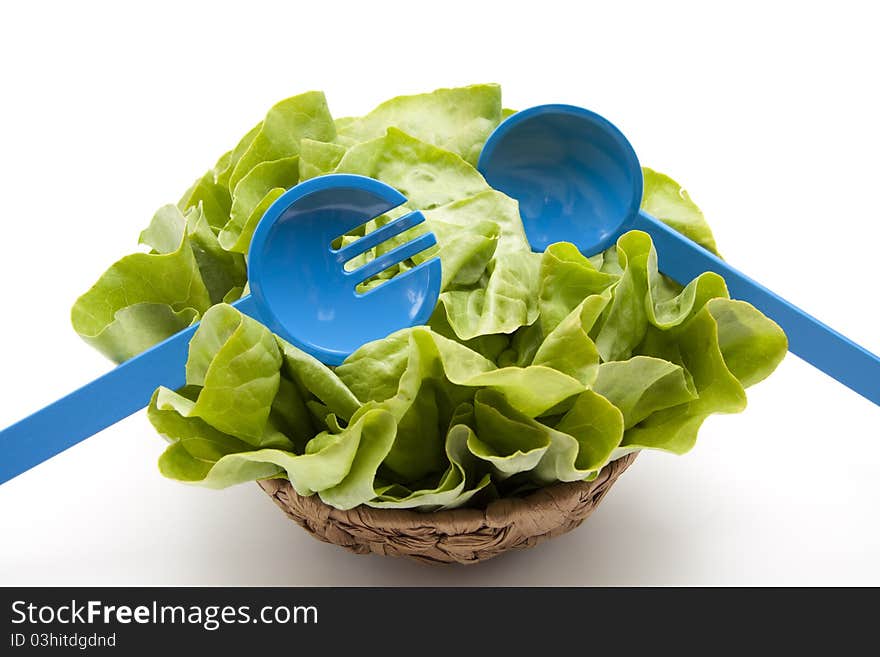 Head lettuce with salad servers