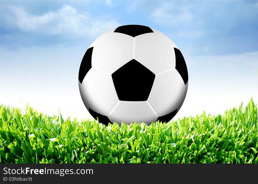 Photo of a football on grass with sky background. Photo of a football on grass with sky background.