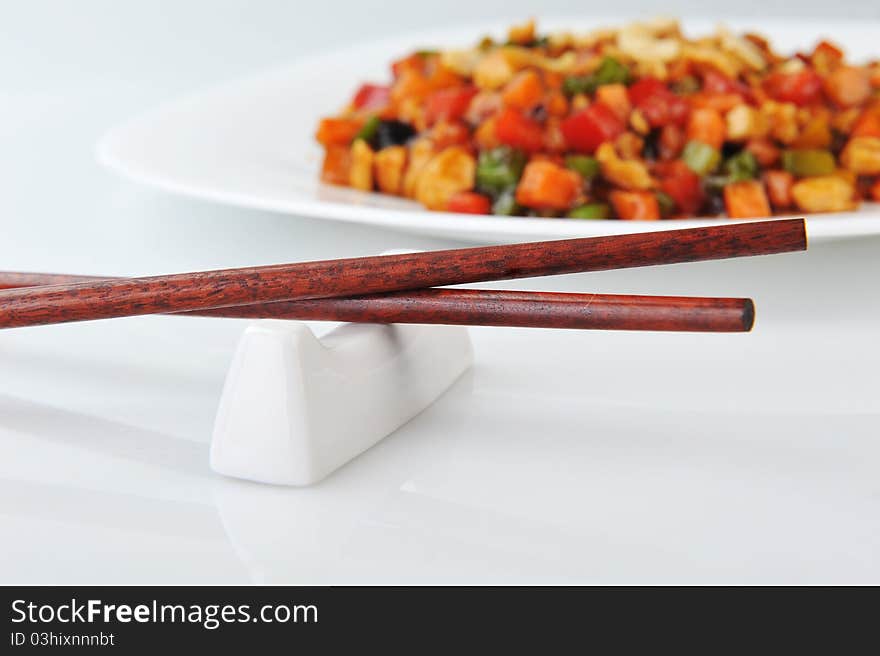 Steamed vegetables and meat with peanut on plate. Chinese cuisine.