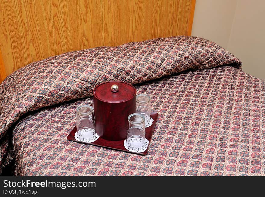 Comfortable bedroom with clean glasses for a relaxing drink. Comfortable bedroom with clean glasses for a relaxing drink.