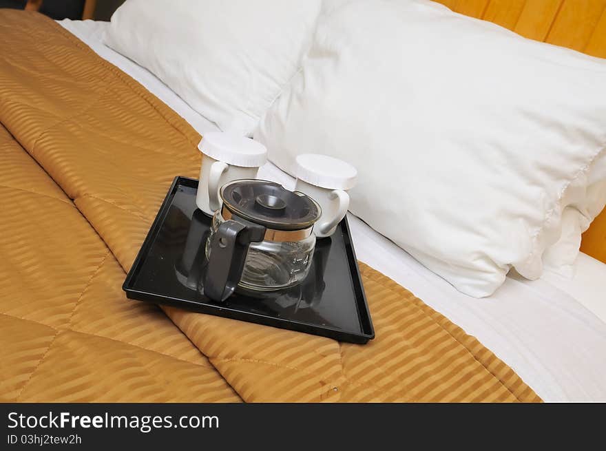 Drinking utensils on bed