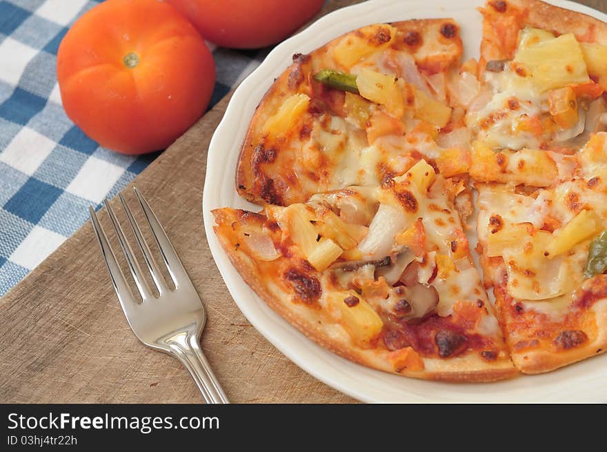 Healthy vegetarian pizza topped with cheese and spices.