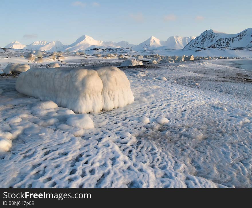 Winter in The Arctic - ice growlers on the shore. Winter in The Arctic - ice growlers on the shore