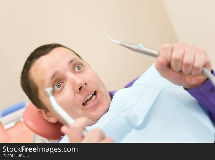 Man waiting for a dentist in stomatology place. Man waiting for a dentist in stomatology place