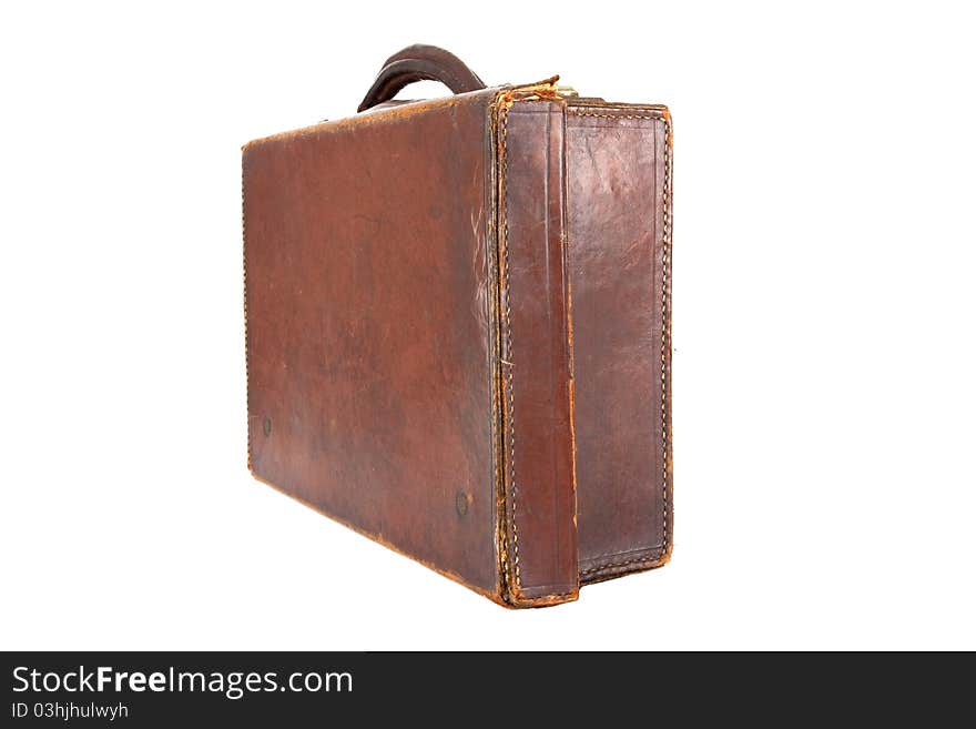 Old style brown leather suitcase on a white background viewed at an angle. Old style brown leather suitcase on a white background viewed at an angle