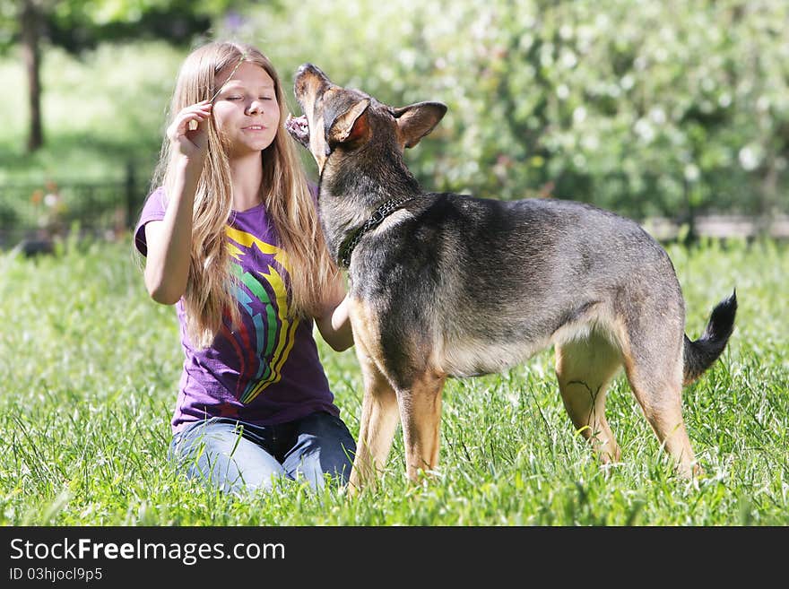 Teen girl with dog outdoors