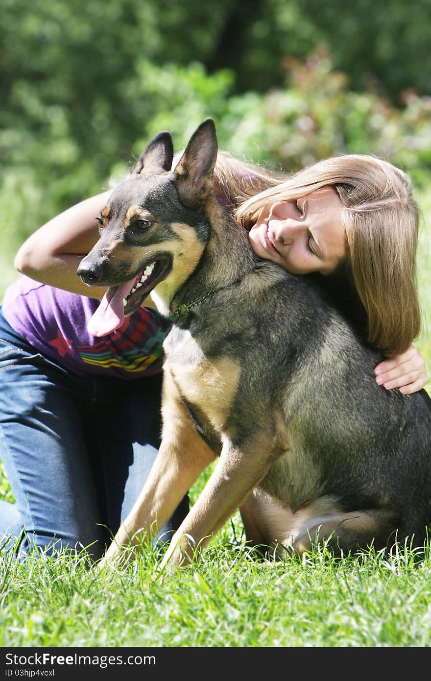 Young girl with dog outdoors