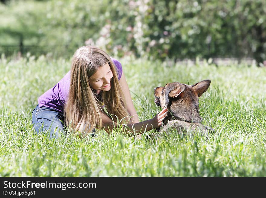 Young girl with dog outdoors