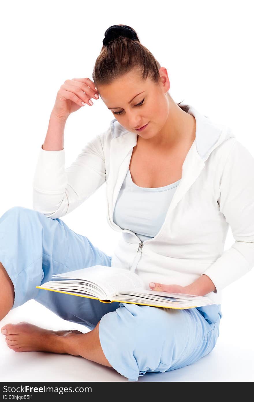 Young woman reading a book