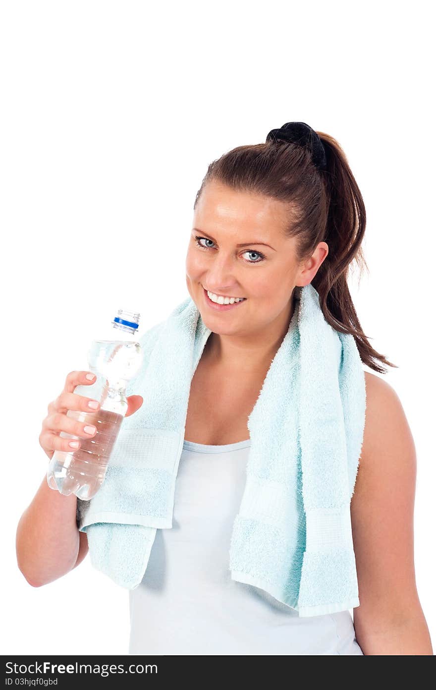 Young woman drinking water after exercise