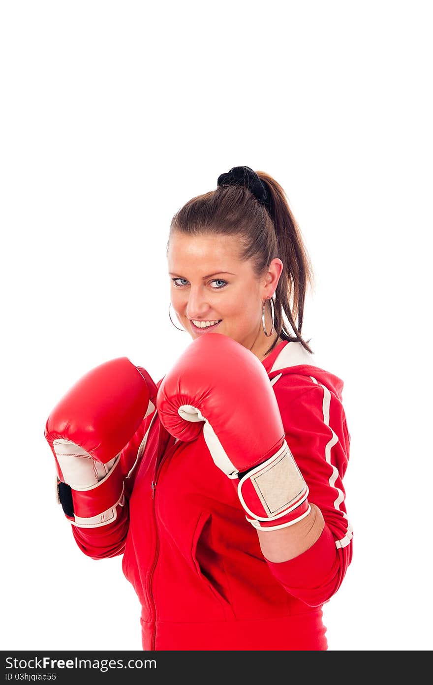 Young woman boxing by on withe