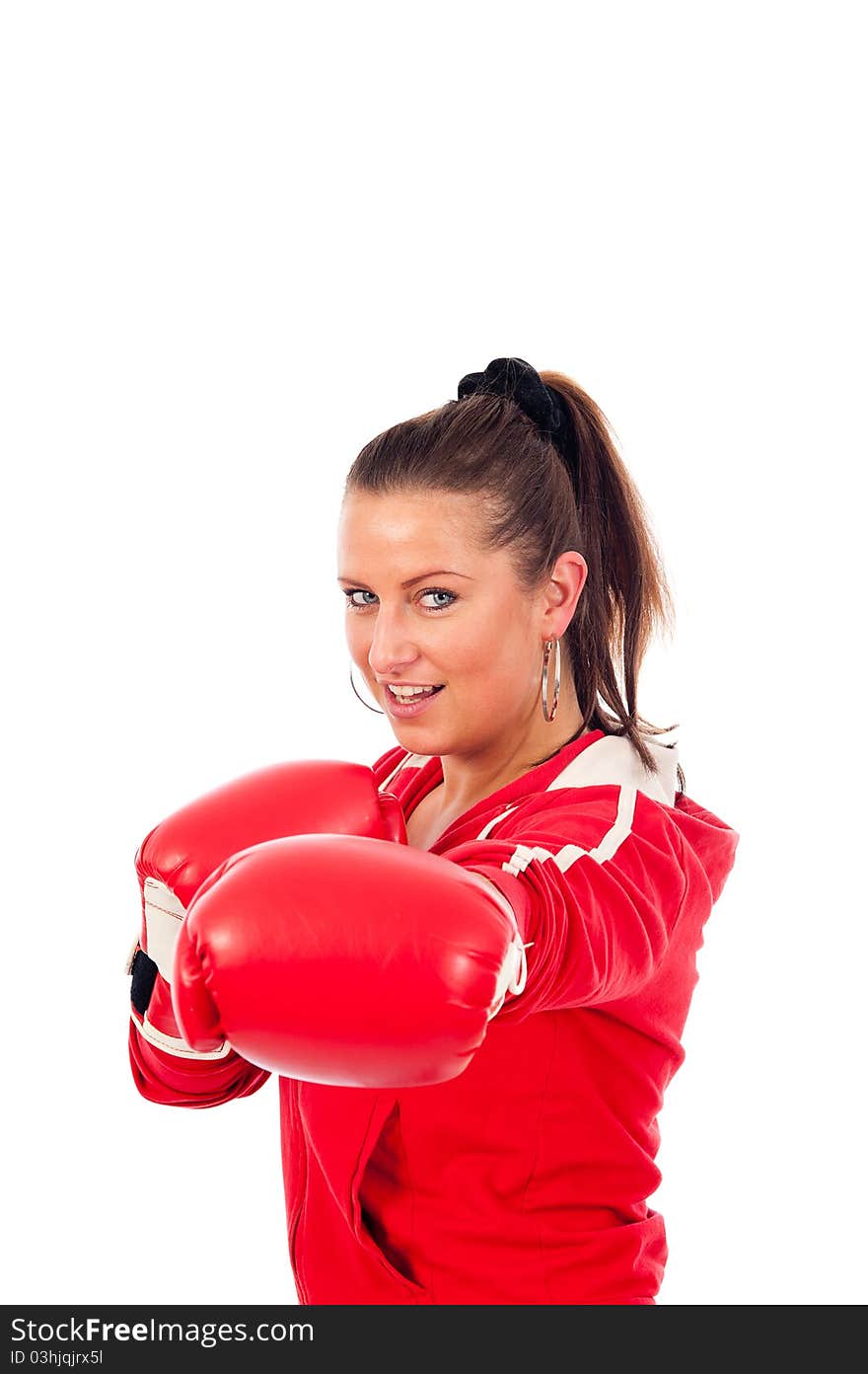 Young woman boxing by on withe