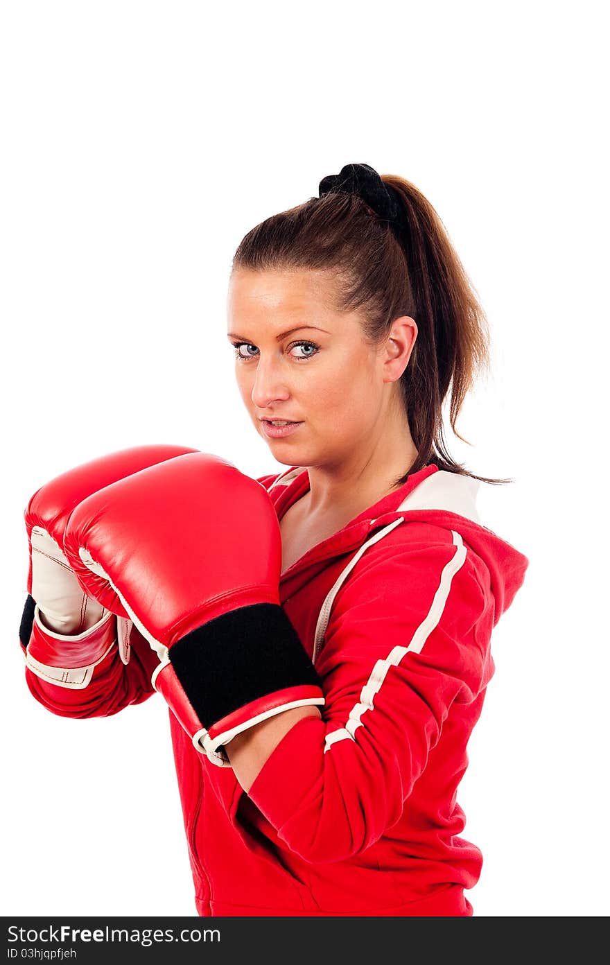 Young woman boxing by on withe