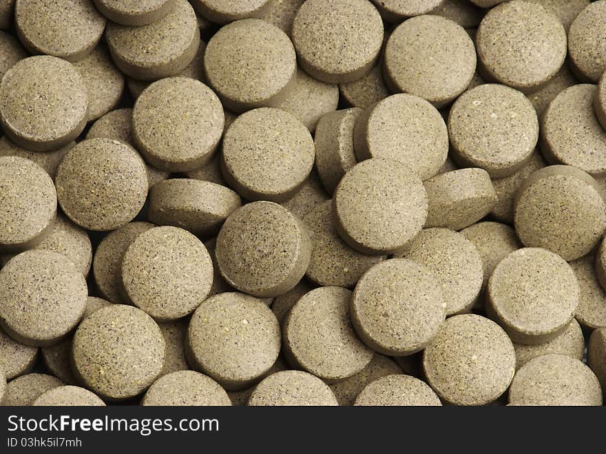 Green and round pills background