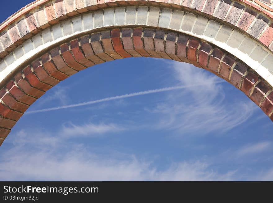 Close up of brickwork arch with sky