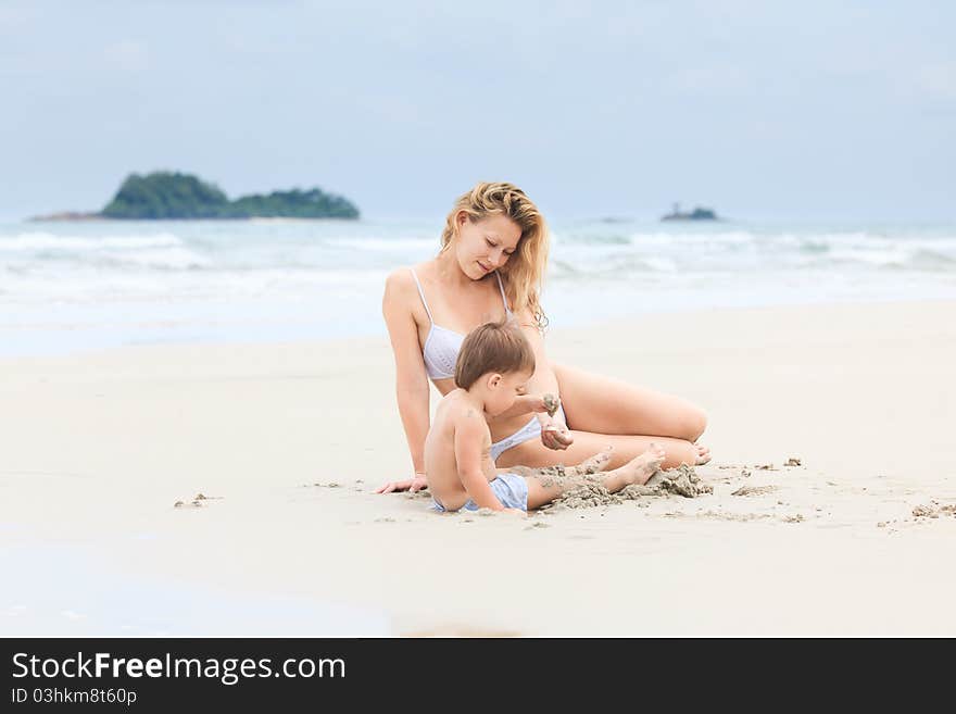 Baby with mother on a beach. Baby with mother on a beach