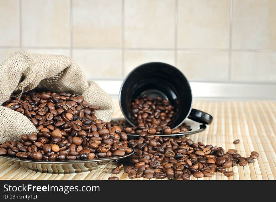 Coffee beans with a cup and sack